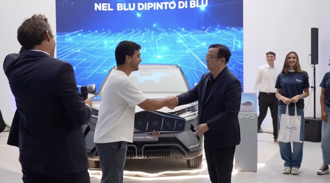 BYD car with red bow and smiling couple