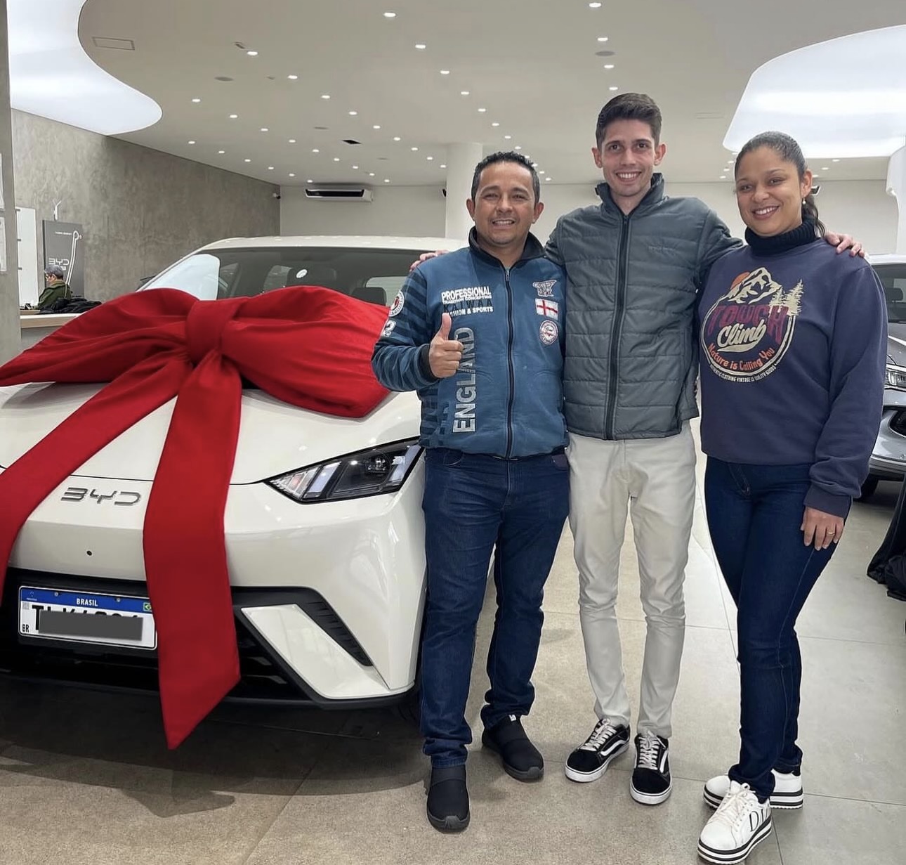 Customers posing in BYD showroom