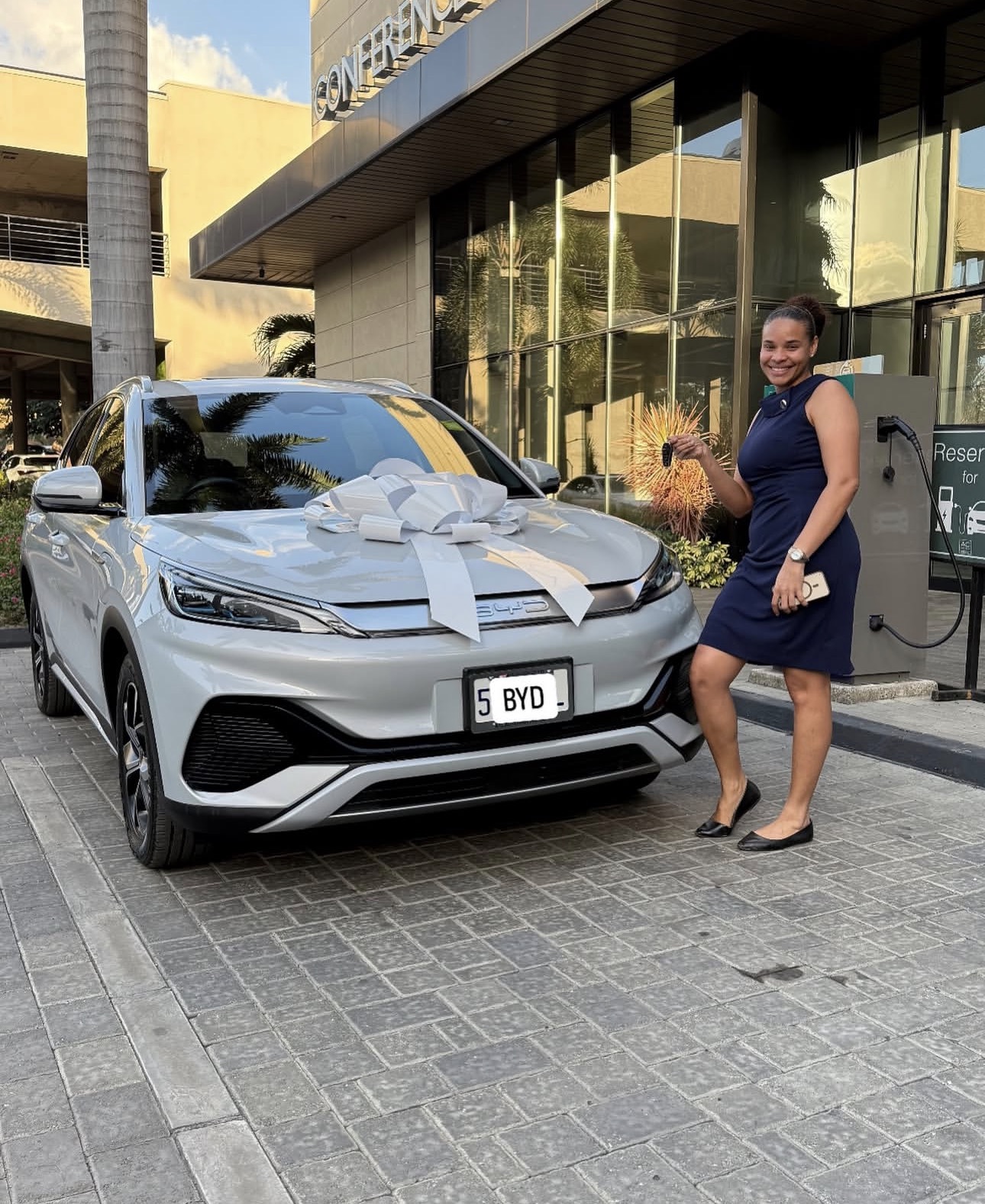 Customer and BYD representative with new car